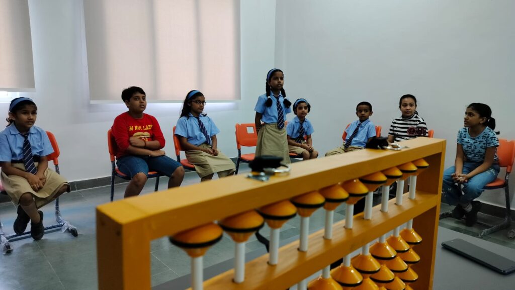 Teaching abacus to enhance the cognitive skills of the children.