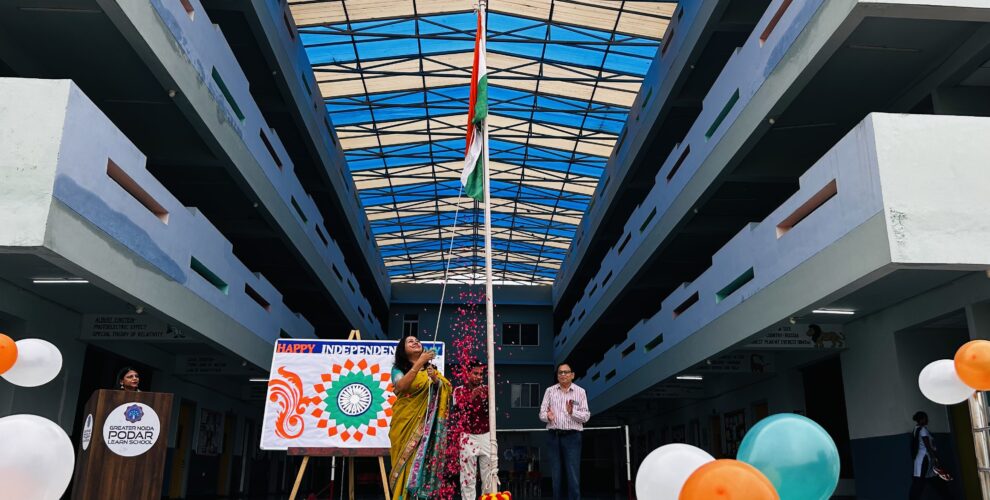 Flag hoisting ceremony held in the school atrium with flower petals showered.